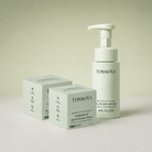 Tossoya skincare products including a bottle and boxes on a light background