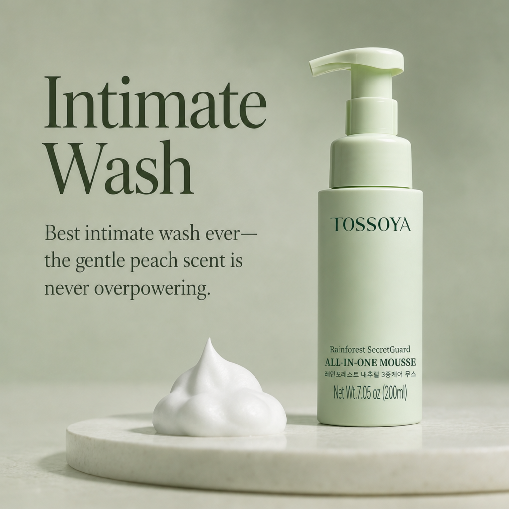 TOSOYOYA Intimate Wash pump bottle in a pale mint green color, displayed next to a dollop of white foaming mousse on a round marble pedestal against a matching sage green background with product text.